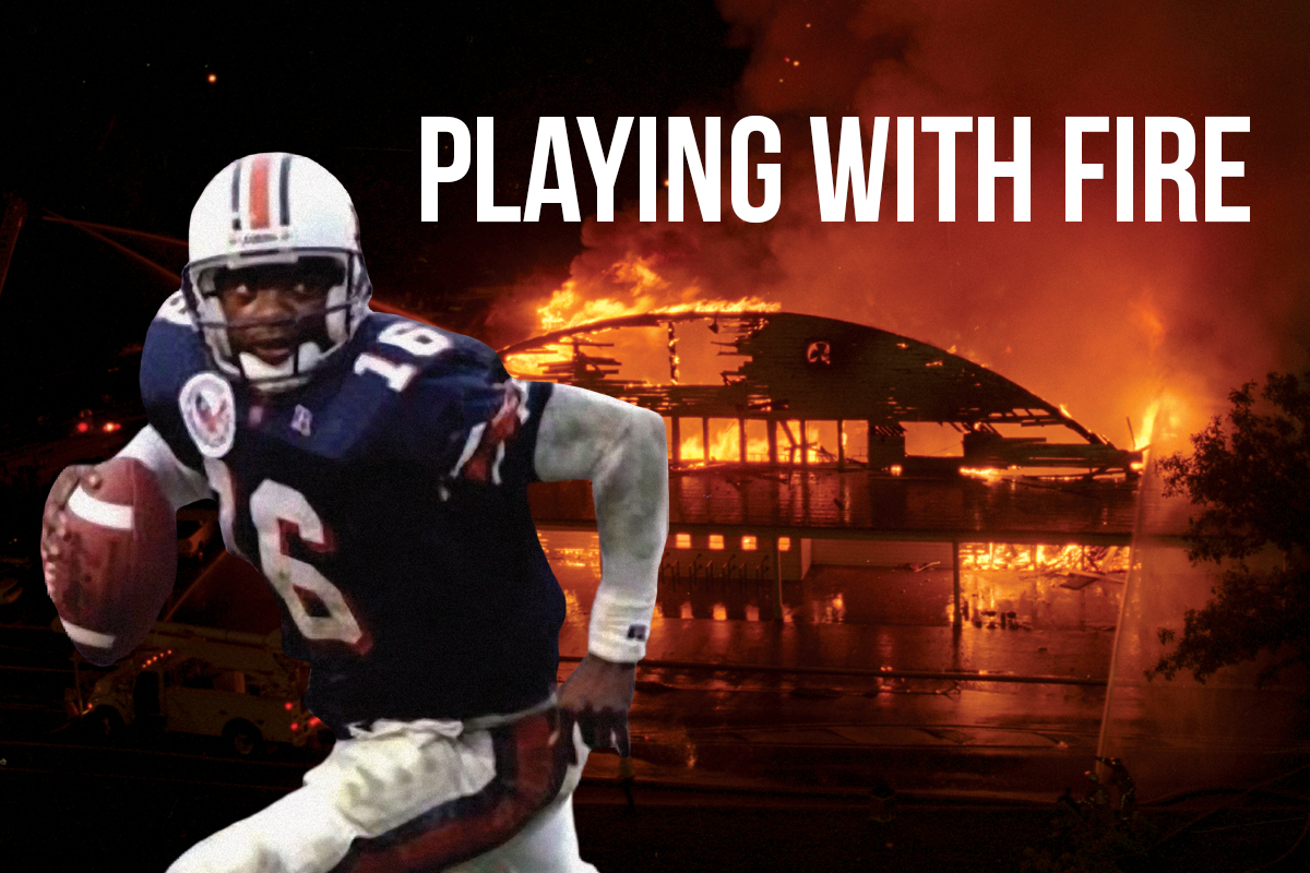 Football player running over the a burning barn picture in back